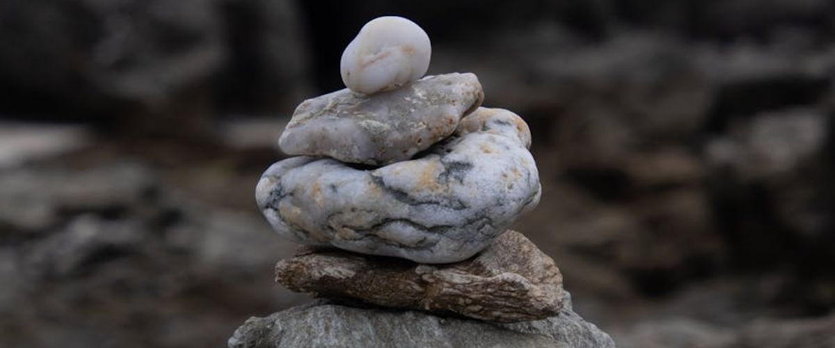 A serene landscape with balanced stones, symbolizing harmony and stability.